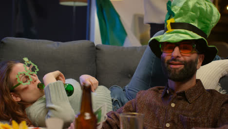 Group-Of-Friends-At-Home-Or-In-Bar-Dressing-Up-Celebrating-At-St-Patrick's-Day-Party-Drinking-Alcohol-And-Having-Fun